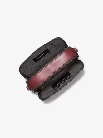 Sac bandoulière en cuir bruni embossé du logo Hudson